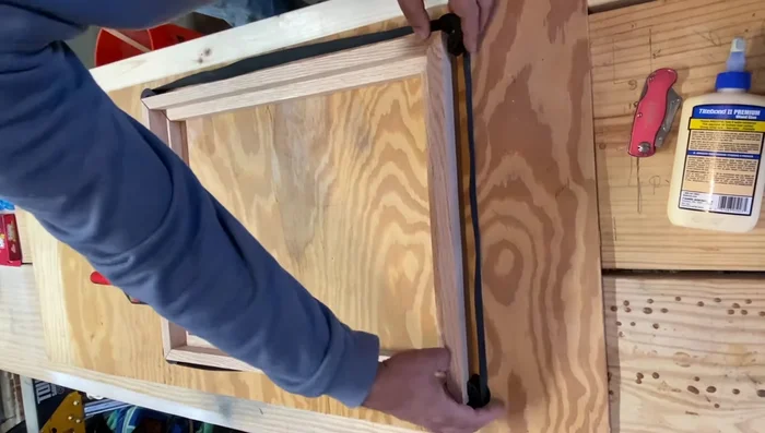 Cut slots for and add splines using a biscuit joiner to reinforce the corners (optional, but recommended).