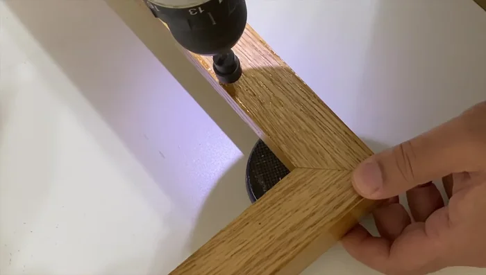 Pre-drill holes for mounting plates on the back of the frame.