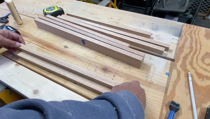 Pre-drill holes for mounting plates on the back of the frame.