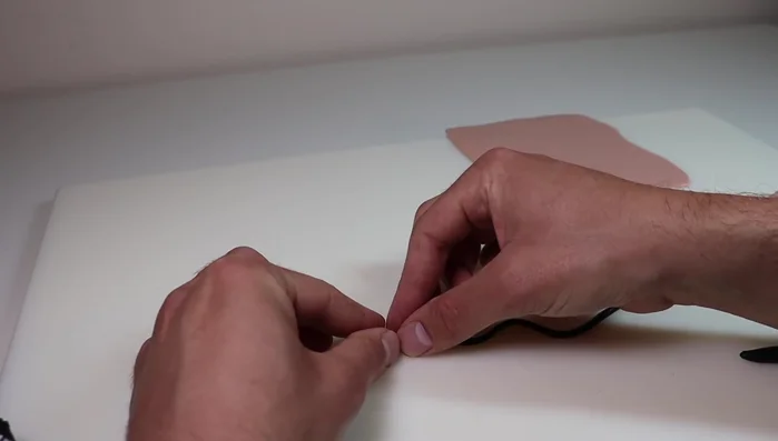 Create eye sockets in the owl's head using a ball stylus and fill with glow-in-the-dark clay. Add irises with black Sculpey Primo clay.