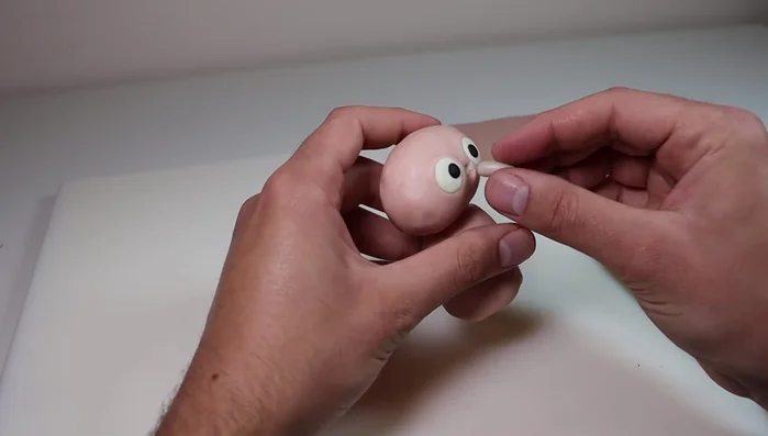 Add the beak using translucent Sculpey Primo clay.