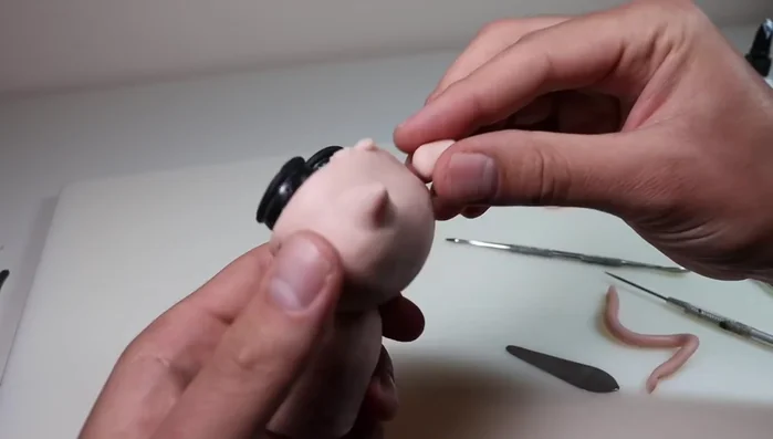 Add plume corns and create openings in the hood for them.