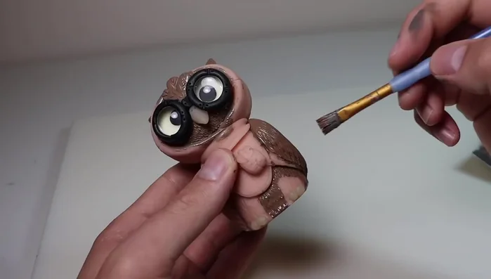 Paint the owl using Folk Art matte acrylics and metallics. Use layering and dry brushing techniques for depth and dimension.