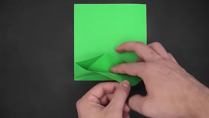 Fold the top side down, slightly beyond the middle.