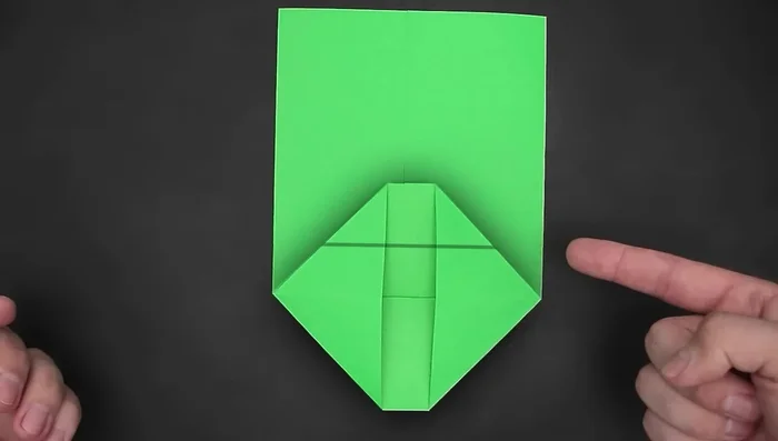 Fold the top side down, slightly beyond the middle.