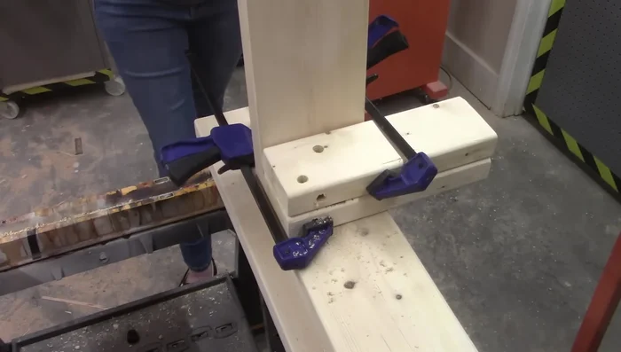 Drill holes in the header and footer boards for bolts to attach to the legs.