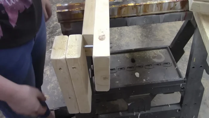 Attach the legs to the rails using three bolts per leg and the T-nuts.