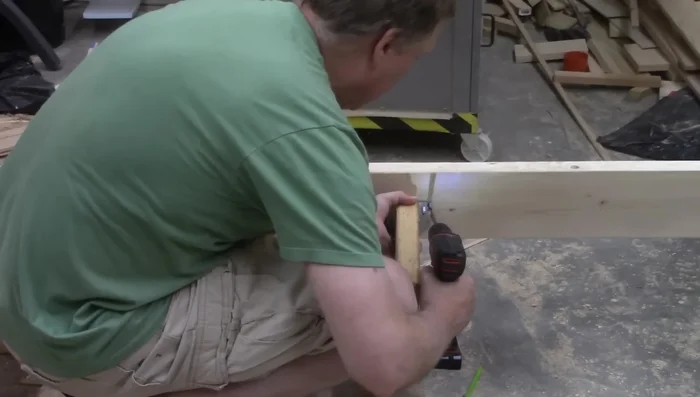 Cut the center support rail to fit within the Raptor hangers.