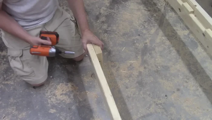 Attach the center leg (11-inch 2x4) using T-nuts and bolts.