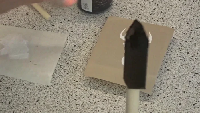 Apply paint using a dry brushing technique with a foam brush. Use multiple thin coats to avoid bleed-through. Let each coat dry completely before applying the next.