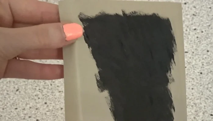 Once dry, carefully peel away the contact paper stencil to reveal your design.