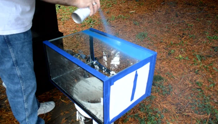 Apply the first coat of paint using even, light strokes, moving back and forth across the surface. Maintain a consistent distance from the tank to prevent runs.