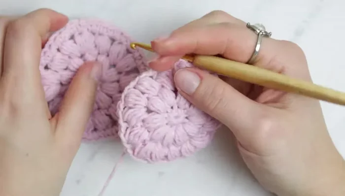 Work a single crochet row to finish the main body of the scrubby.