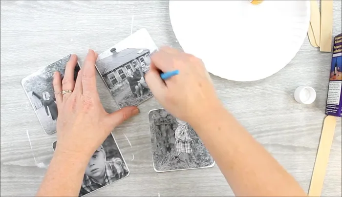 Seal the image. Apply two coats of decoupage medium to the transferred image, ensuring complete coverage and allowing each coat to dry completely. This step is essential to protect the image from the resin.