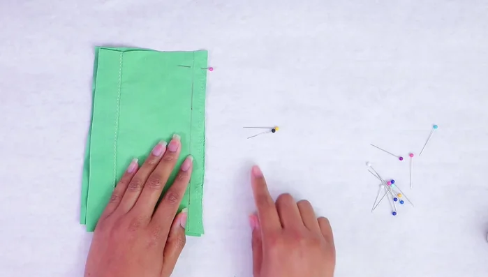 For curves, add more pins to maintain fabric alignment.