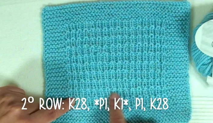 Continue knitting the broken rib stitch pattern (rows 1-4) for 160 rows, maintaining the 28-stitch edges.