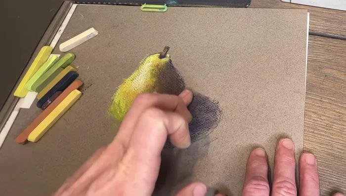 Lightly blend with your finger to soften the texture and create a painterly effect (optional).