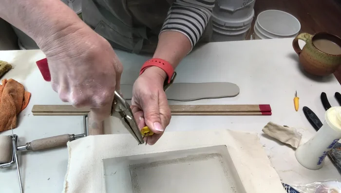 Modifying a corn holder into a cutter to create evenly shaped foot ring pieces. 