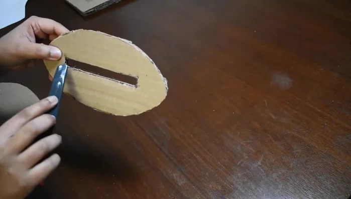 Assemble the base using two of the rectangular pieces, creating a hole for attaching the stand, and covering it with the third piece.