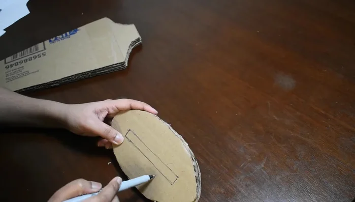 Assemble the base using two of the rectangular pieces, creating a hole for attaching the stand, and covering it with the third piece.