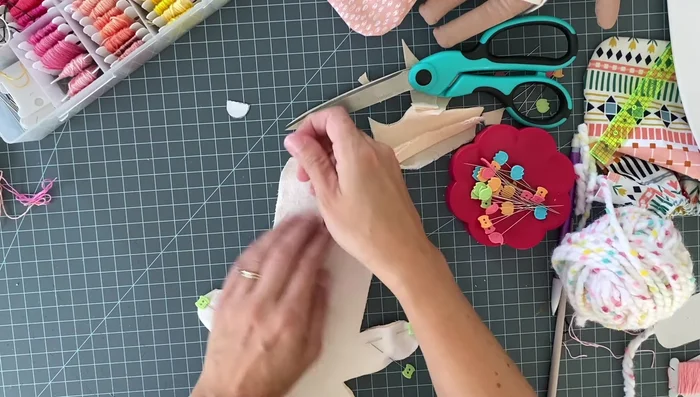 Sew the doll together using a quarter inch seam allowance, using a smaller stitch length for curves. Remember to back stitch at the beginning and end.