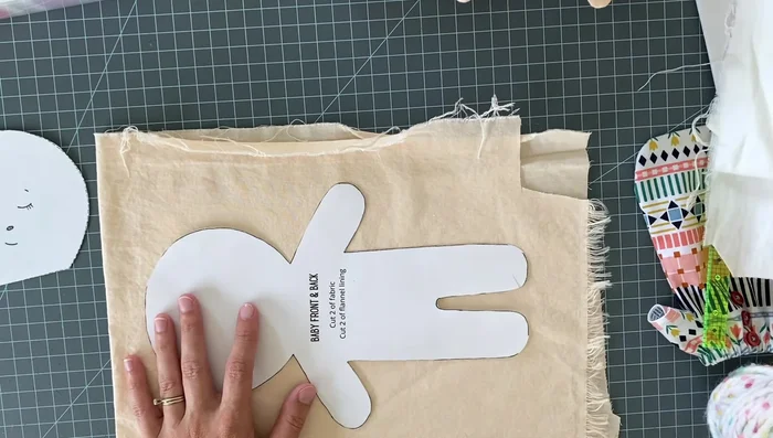 Baste the flannel pieces to the skin tone fabric pieces (or pin and baste each piece separately to the flannel for easier sewing with children).