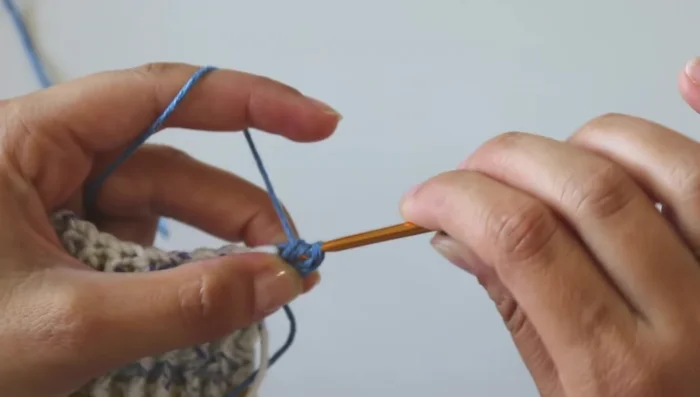 Work four rows with the multicolor yarn.