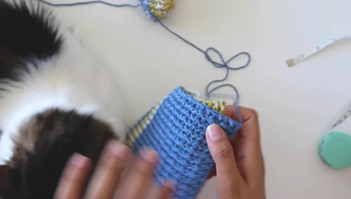 With right sides facing, join the two slipper pieces together using a whip stitch, starting at the heel and working your way around.