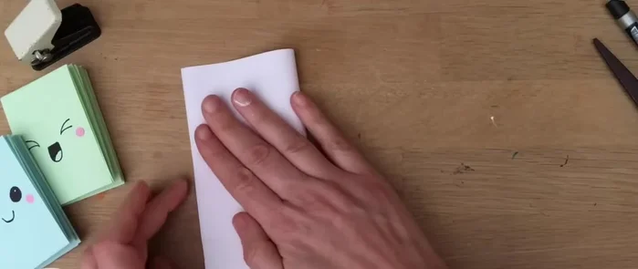 Fold the paper over again.