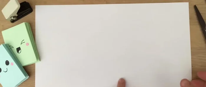 Fold the paper over again.