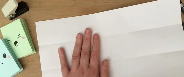 Fold the paper over again.