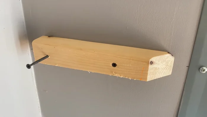 Attach the wall mounts to the studs, ensuring they are level and leaving enough space for the shelf's face piece.