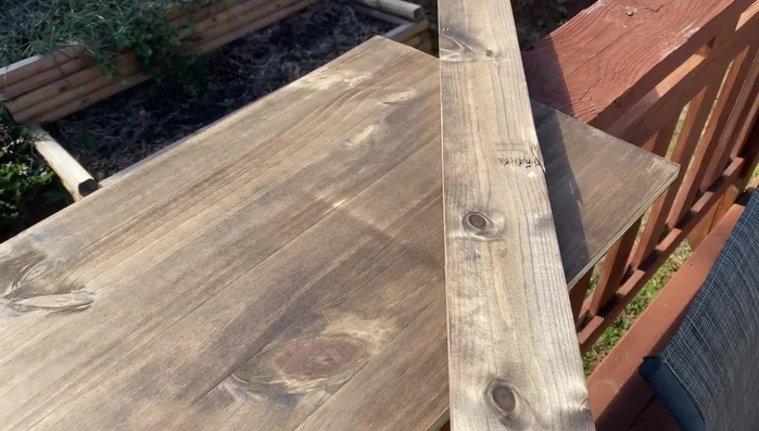 Secure the top trim piece with brad nails, ensuring they go into the wall mounts.