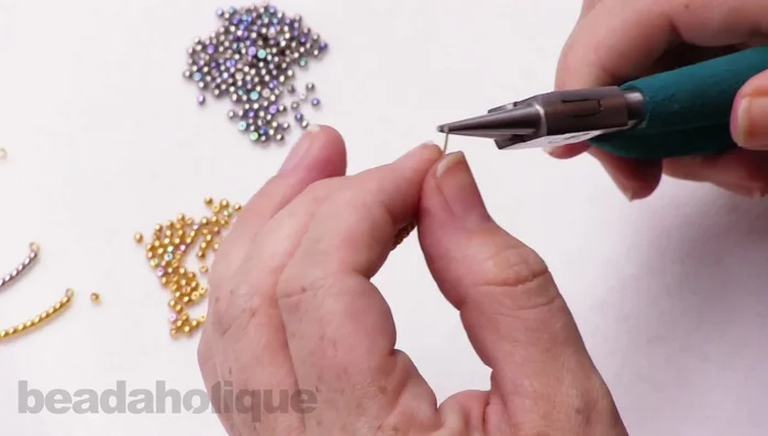 Crimp the second loop with crimping pliers for extra security (optional).