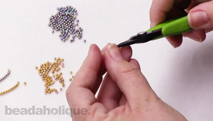 Close the loops to secure the pieces. Attach to earring hooks.