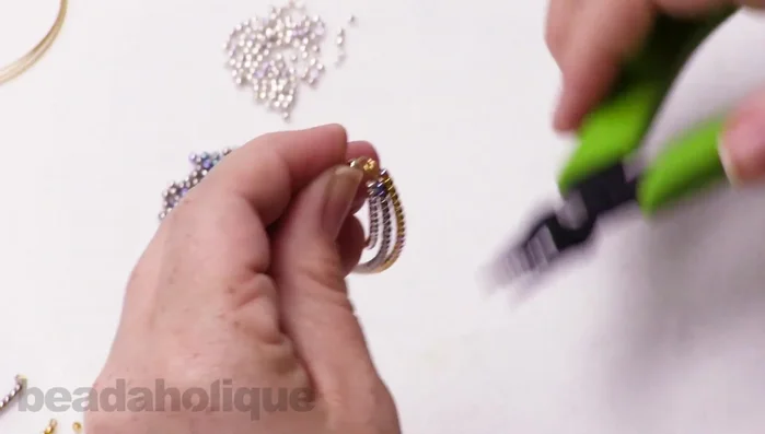 Close the loops to secure the pieces. Attach to earring hooks.