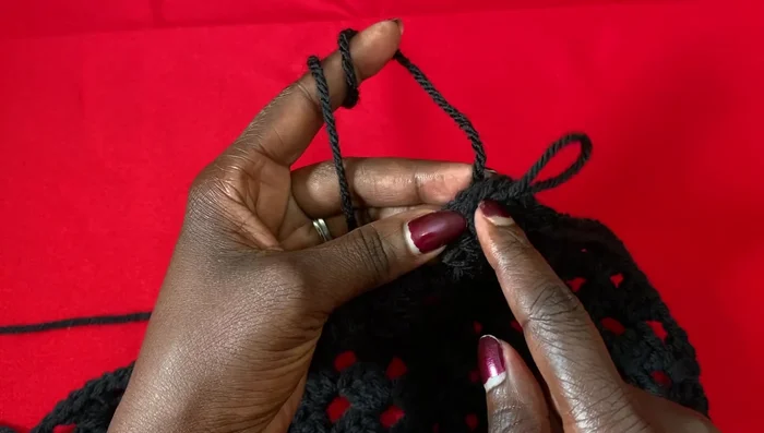 Change yarn color by cutting the old yarn and weaving in the end. Begin the new color with a chain 1 and chain 2.