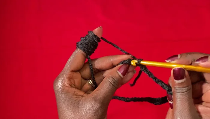 Join the neckline with a slip stitch. This creates the neck opening of the poncho.