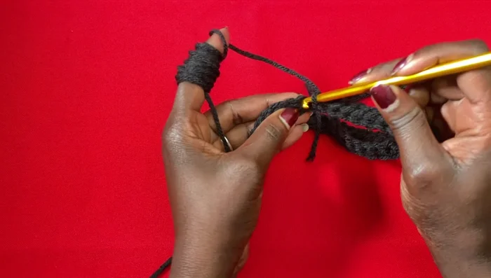 Join the neckline with a slip stitch. This creates the neck opening of the poncho.