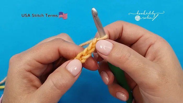 Work four more double crochets into the same chain as step 4.