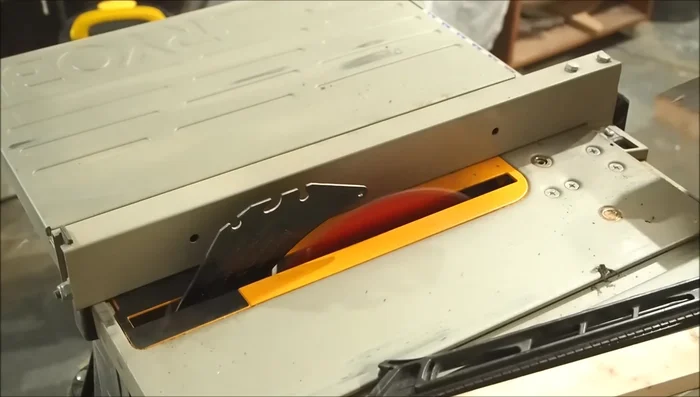 Assemble each wall using five boards, aligning them with the spacer and securing with brad nails.