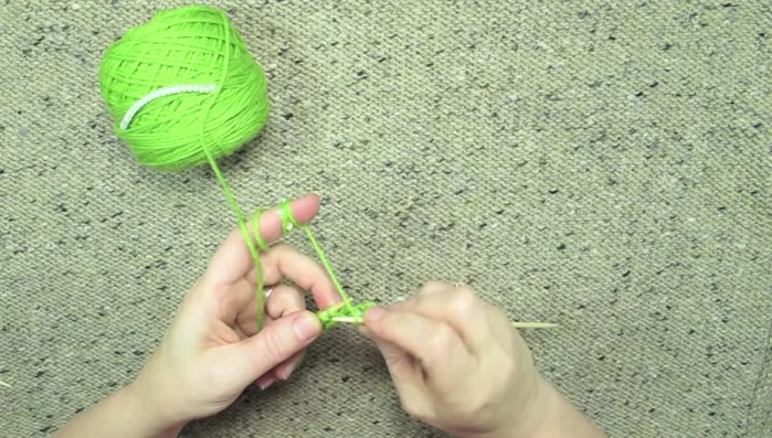 Knit the next stitch. The bead is now incorporated into the work, on the back side.