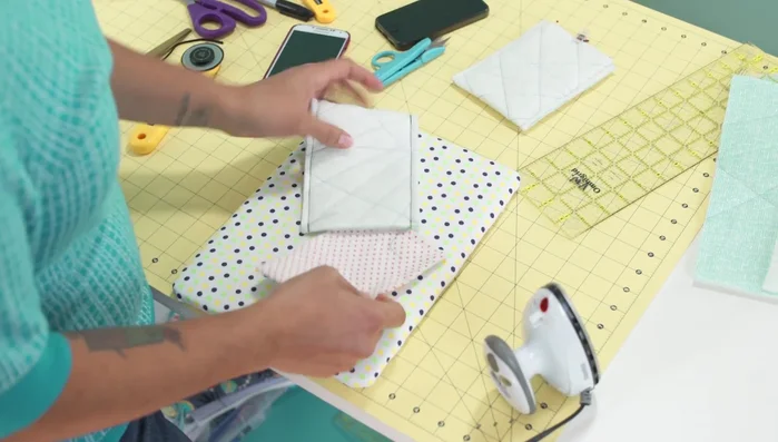 Turn and press: Turn the lining right side out through the opening. Slip the lining inside the outer fabric, pretty sides touching. Press well.