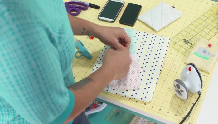 Attach button: Hand-stitch the button to the front of the cozy, ensuring it's positioned correctly for closure.