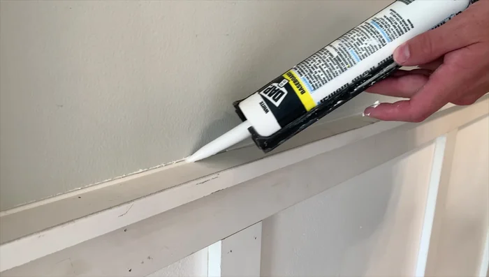 Caulk all seams and nail holes.