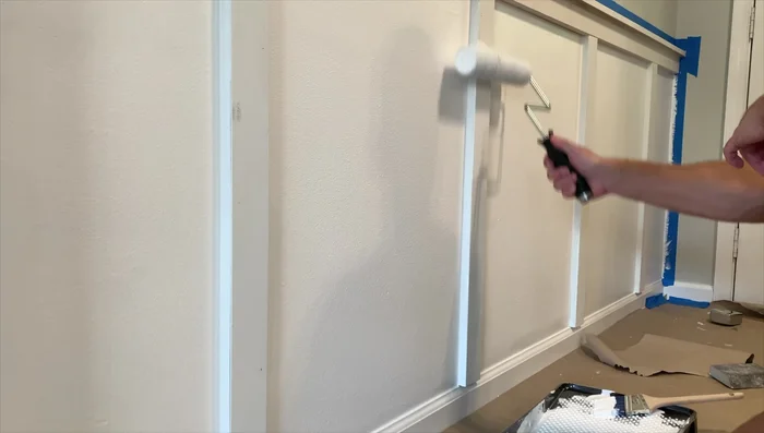 Apply a second and third coat of paint as needed, using a brush for detail work.