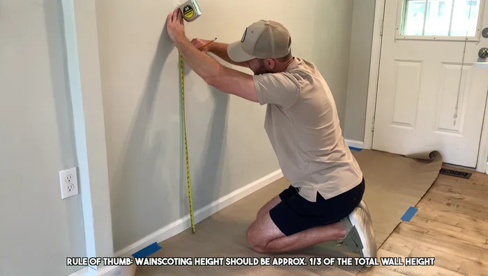 Mark the desired height (35 1/2 inches in this example) for the top rail on the wall using a level.