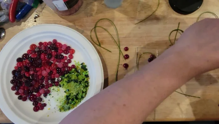 Add additional details and clusters of tomatoes as desired, using small glass pieces and glue to secure them.