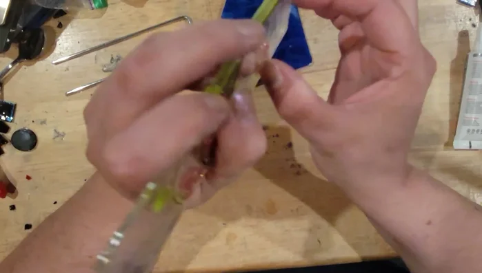 Clean your garden stake and apply a bead of B7000 glue or similar adhesive to the back of the stake, leaving about a quarter inch unglued.