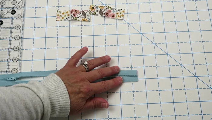 Create and attach zipper pulls.